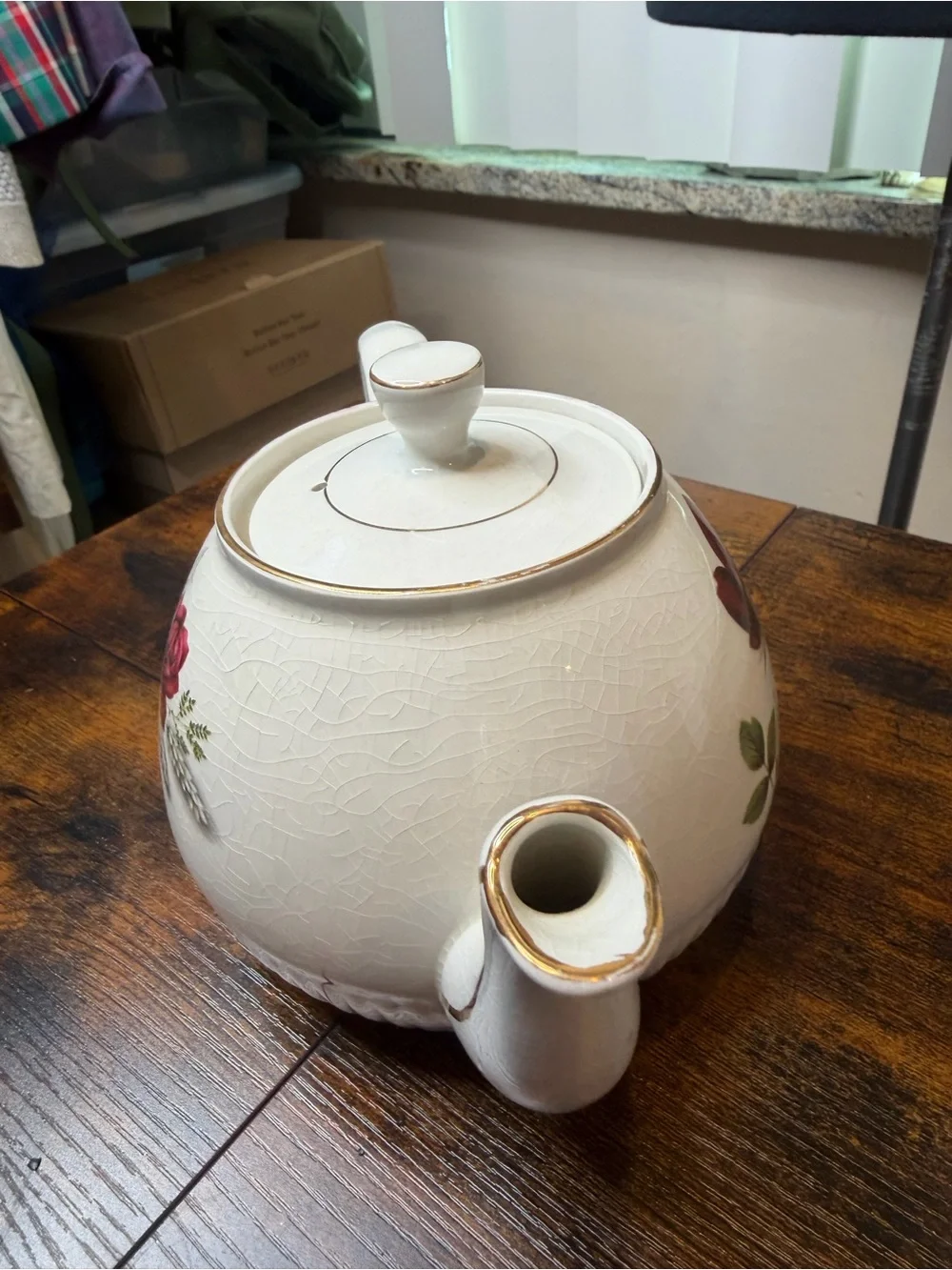 Vintage Ellgreave England red rose teapot featuring delicate gold trim.